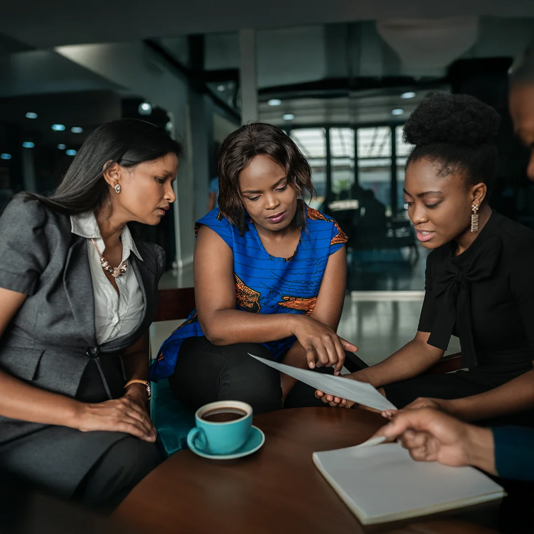Business Team Reviewing Documents During Meeting