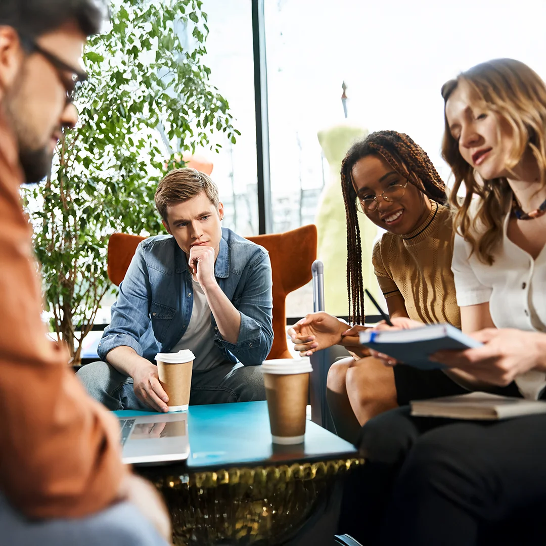 Collaborative Team Brainstorming In A Bright Office Lounge