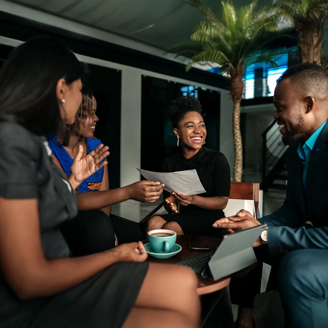 Colleagues Celebrating Success During Team Meeting