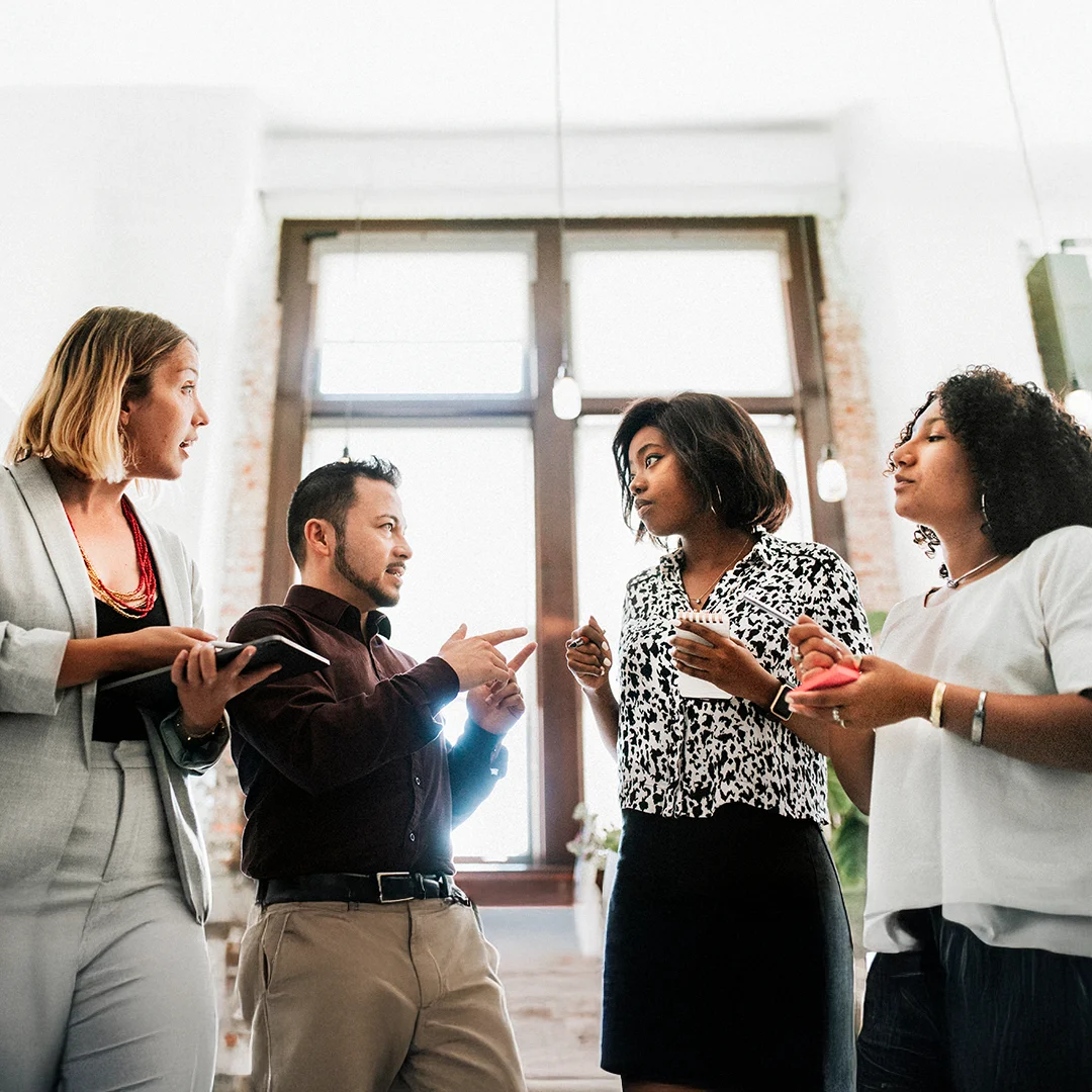 Coworkers Engaged In Animated Team Discussion