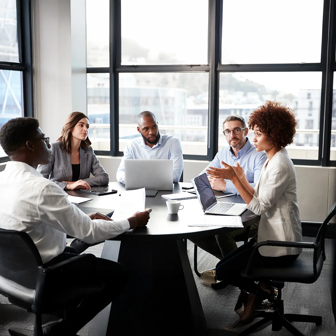 Diverse Team Meeting Around Conference Table